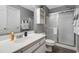 Functional bathroom with a shower featuring sliding glass doors and a white vanity sink at 1220 River Oak Dr. # 22C, Myrtle Beach, SC 29579