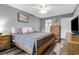 Comfortable bedroom featuring a wooden bed frame and dresser with gray walls at 1220 River Oak Dr. # 22C, Myrtle Beach, SC 29579