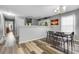 Charming dining area with wood-look floors, adjacent to the kitchen and living area at 1220 River Oak Dr. # 22C, Myrtle Beach, SC 29579