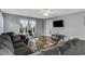 Cozy living room featuring a large sectional sofa, wood-look flooring, and television at 1220 River Oak Dr. # 22C, Myrtle Beach, SC 29579