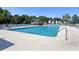 Inviting outdoor pool with lounge chairs and umbrellas for relaxing by the crystal-clear water at 1220 River Oak Dr. # 22C, Myrtle Beach, SC 29579
