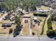 Aerial view of the property, showcasing the home and its surroundings in a picturesque setting at 1301 Highway 701 South, Loris, SC 29569