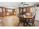 Eat-in kitchen with stainless steel refrigerator, ceiling fan, and wood-look vinyl flooring at 1301 Highway 701 South, Loris, SC 29569