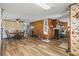 Open living room with wood look vinyl floors, ceiling fan, with built-in shelving at 1301 Highway 701 South, Loris, SC 29569