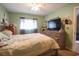 Bedroom featuring a dresser with a tv and a window with lots of light at 1301 Pridgen Rd. # 1101, Myrtle Beach, SC 29577