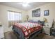 Cozy bedroom featuring a ceiling fan and comfortable bed with decorative quilt at 1301 Pridgen Rd. # 1101, Myrtle Beach, SC 29577