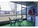 Screened in porch features outdoor seating with green carpet at 1301 Pridgen Rd. # 1101, Myrtle Beach, SC 29577