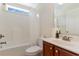 Bathroom with a shower and bathtub combination, and cherry wood vanity with solid surface countertop at 1341 Brown Pelican Dr., Myrtle Beach, SC 29577