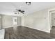 Spacious living room with wood-look flooring and ceiling fan fixture at 1455 Jackson Village Rd., Georgetown, SC 29440