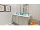 Bathroom featuring double sinks with white cabinetry and modern decor at 1459 Porchfield Dr., Conway, SC 29526