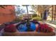 Water fountain with brick base and red flowering plants with trees nearby at 1459 Porchfield Dr., Conway, SC 29526