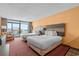 Inviting hotel bedroom with two beds and a sliding glass door to a balcony overlooking the ocean at 1501 S Ocean Blvd. # 1005, Myrtle Beach, SC 29577