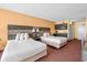 Hotel room featuring two queen beds, kitchenette, and neutral decor at 1501 S Ocean Blvd. # 1005, Myrtle Beach, SC 29577