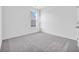Carpeted bedroom features natural light with a large window at 155 Joyce Dr, Longs, SC 29568