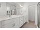 Bathroom features double vanity with a large mirror, modern lighting, and neutral color tones at 1587 Sayebrook Pkwy., Myrtle Beach, SC 29588