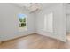 Modern dining area with hardwood floors, a stylish chandelier, and large windows at 1587 Sayebrook Pkwy., Myrtle Beach, SC 29588