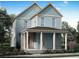 Charming two-story blue home with a welcoming front porch and classic architectural details at 1587 Sayebrook Pkwy., Myrtle Beach, SC 29588