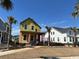 New construction home with bright yellow wrap, front porch, and situated on a grassy lot at 1587 Sayebrook Pkwy., Myrtle Beach, SC 29588