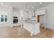 Bright kitchen boasts stainless steel appliances, stone countertops, a spacious island, and modern pendant lighting at 1587 Sayebrook Pkwy., Myrtle Beach, SC 29588