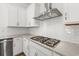 Close-up shot showcases stainless steel gas cooktop, subway tile backsplash, and light countertops in bright kitchen at 1587 Sayebrook Pkwy., Myrtle Beach, SC 29588
