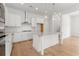 Modern kitchen with white cabinets, quartz countertops, stainless steel appliances, and a center island at 1587 Sayebrook Pkwy., Myrtle Beach, SC 29588