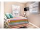 Comfortable bedroom with natural light and a mounted TV at 1733 Neptune Rd., Myrtle Beach, SC 29575