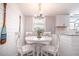 Bright dining area featuring shiplap walls and a cozy round table perfect for gatherings at 1733 Neptune Rd., Myrtle Beach, SC 29575