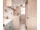 Bright laundry room with a washing machine and dryer and a blue vanity at 1733 Neptune Rd., Myrtle Beach, SC 29575
