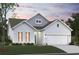 Charming home featuring a manicured lawn, two-car garage, and appealing architectural design at 179 Glengrove Lane, Murrells Inlet, SC 29576