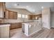 Kitchen featuring stainless appliances, island, hard wood floors, and lots of cabinet space at 179 Glengrove Lane, Murrells Inlet, SC 29576