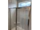 New glass shower with chrome fixtures and tiled walls in bathroom at 180 Glengrove Lane, Murrells Inlet, SC 29576