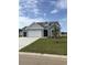 Charming single-Gathering home with a three-car garage, manicured lawn, and classic curb appeal at 180 Glengrove Lane, Murrells Inlet, SC 29576