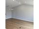 Open living room with vaulted ceilings, recessed lighting, and new hardwood floors at 180 Glengrove Lane, Murrells Inlet, SC 29576