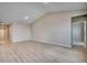 Open concept living room featuring wood flooring, neutral walls, and high ceilings at 180 Glengrove Lane, Murrells Inlet, SC 29576