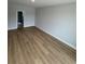 Spacious living room with hardwood floors and a view into another room at 180 Glengrove Lane, Murrells Inlet, SC 29576