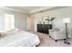 Comfortable bedroom with a dark wood dresser, neutral color scheme, and plush carpeting for a relaxing ambiance at 1813 Brook Park Pl., Conway, SC 29526