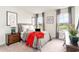 Comfortable bedroom with large windows offering scenic views, complemented by stylish decor and ample natural light at 1813 Brook Park Pl., Conway, SC 29526
