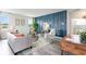 Cozy living room with modern decor, including blue accent wall and stylish furniture at 1813 Brook Park Pl., Conway, SC 29526