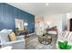 Inviting living room features stylish blue accent wall, elegant decor, and an open layout, perfect for relaxation at 1813 Brook Park Pl., Conway, SC 29526