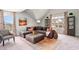 Comfortable living room features a large sectional, ottoman, stylish rug, and plenty of natural light at 1813 Brook Park Pl., Conway, SC 29526