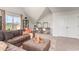 Spacious living room with a large sectional, workstation, and great natural light at 1813 Brook Park Pl., Conway, SC 29526