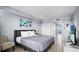 Comfortable bedroom featuring a king bed, flat screen TV, and access to the balcony at 2000 N Ocean Blvd. # 1509, Myrtle Beach, SC 29577