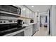 Well-equipped kitchen featuring modern appliances, ample cabinet space, and granite countertops at 2000 N Ocean Blvd. # 1509, Myrtle Beach, SC 29577