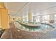 Indoor lazy river with tropical decor, sun loungers and poolside decor at 2000 N Ocean Blvd. # 1509, Myrtle Beach, SC 29577