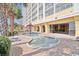 Bright splash pad near a resort building featuring outdoor seating and access to a lazy river at 2000 N Ocean Blvd. # 1509, Myrtle Beach, SC 29577