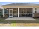 Back of house featuring a screened in porch with outdoor seating at 2049 Oxford St., Myrtle Beach, SC 29577