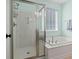 Bathroom showcasing a glass shower and a separate soaking tub at 2049 Oxford St., Myrtle Beach, SC 29577