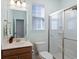 Bathroom featuring a sink with a wooden cabinet and a glass-enclosed shower at 2049 Oxford St., Myrtle Beach, SC 29577