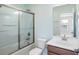 Bathroom with tub and shower combination features sliding glass door and single sink vanity at 2049 Oxford St., Myrtle Beach, SC 29577