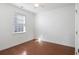 Bright bedroom with hardwood floors, a ceiling fan, and a window with blinds at 2049 Oxford St., Myrtle Beach, SC 29577